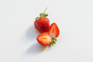 Red berry strawberry with leaves isolated on white background