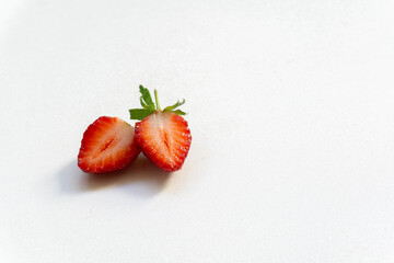 Red berry strawberry with leaves isolated on white background