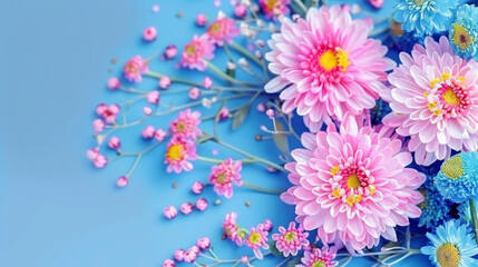 Colorful floral arrangement with pink and blue flowers set against a tranquil blue backdrop, conveying freshness and serenity.
