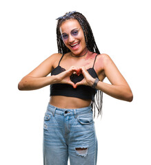 Young braided hair african american with birth mark wearing sunglasses over isolated background smiling in love showing heart symbol and shape with hands. Romantic concept.