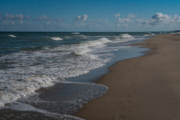 View of the incoming wave on the Baltic Sea on the shore of the Curonian Spit on a summer day, Kaliningrad region, Russia