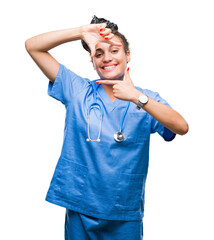 Young braided hair african american girl professional surgeon over isolated background smiling making frame with hands and fingers with happy face. Creativity and photography concept.