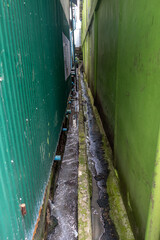 Sewage drain - outflow between houses on city street