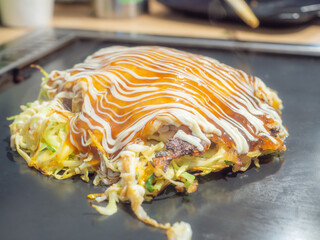 Okonomiyaki on an iron pan in Japan