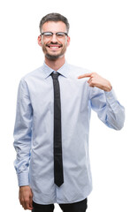 Young business man with surprise face pointing finger to himself