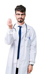 Fototapeta premium Young doctor man wearing hospital coat over isolated background Doing Italian gesture with hand and fingers confident expression