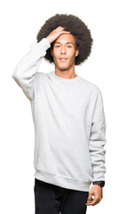 Fototapeta na wymiar Young african american man with afro hair wearing sporty sweatshirt Smiling confident touching hair with hand up gesture, posing attractive