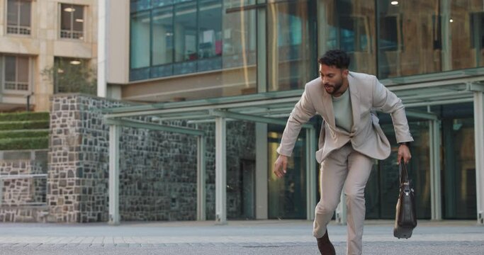 Business man, city and spill coffee with mistake, walking and check time with trip, schedule and outdoor in street. Person, employee and steps with mess for drink on metro sidewalk by office building