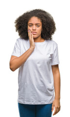 Young afro american woman over isolated background touching mouth with hand with painful expression...