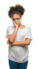 Young afro american woman wearing glasses over isolated background thinking looking tired and bored...