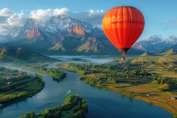 Deurstickers A breathtaking view of a hot air balloon floating above a majestic mountain landscape © Veniamin Kraskov