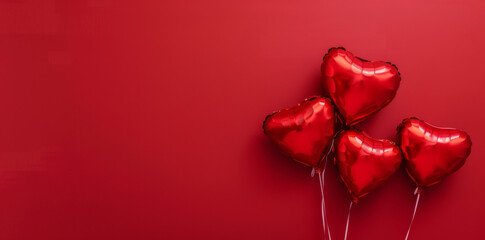Valentine's day background with heart shaped balloons on red background, top view