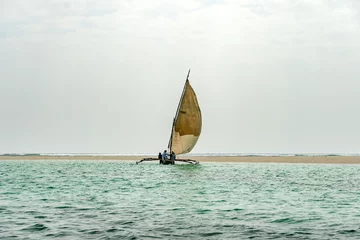 Fototapeten travelling Africa Kenya and Zanzibar seascape with crystal clear turquoise water and traditional sail boat landscape from Diani Beach © diy13