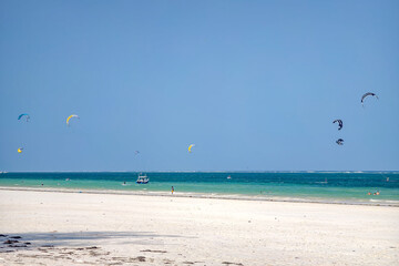 man is kitesurfing in the Caribbean sea. Diani Beach, Kenya, Mombasa.