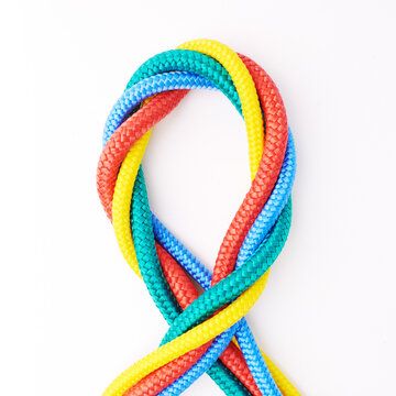 Colorful, ropes and tied for together in studio to represent unity, connect and trust. Secure, string and reef knotted for security to stop movement of objects safety on isolated white background
