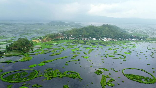 Aerial view loktak lake is the largest freshwater lake and thanga village in India as well as the largest lake in manipur north east India.