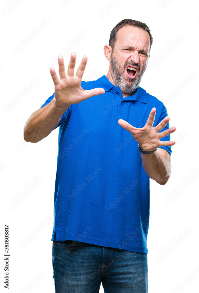 Wall mural Middle age hoary senior man over isolated background afraid and terrified with fear expression stop gesture with hands, shouting in shock. Panic concept.