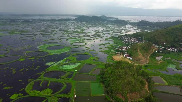 Aerial view loktak lake is the largest freshwater lake and thanga village in India as well as the largest lake in manipur north east India.