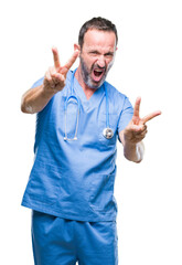 Middle age hoary senior doctor man wearing medical uniform over isolated background smiling looking to the camera showing fingers doing victory sign. Number two.