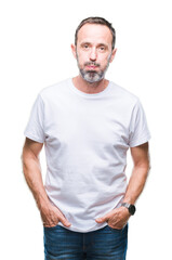 Fototapeta premium Middle age hoary senior man wearing white t-shirt over isolated background puffing cheeks with funny face. Mouth inflated with air, crazy expression.