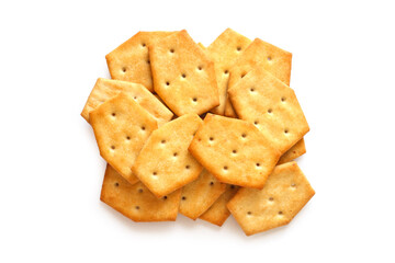 Pile of hexagonal crackers on white background. Salty biscuits. Top view.