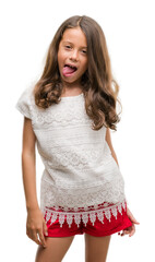 Brunette hispanic girl sticking tongue out happy with funny expression. Emotion concept. © Krakenimages.com