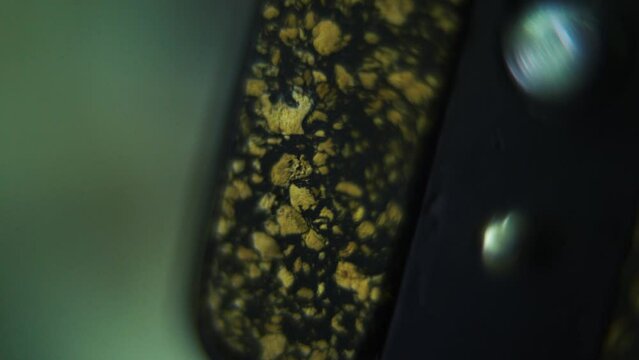 Macro shot of a tripod plate close up, camera gear, smooth slide right crane movement, 120fps slow motion, Full HD
