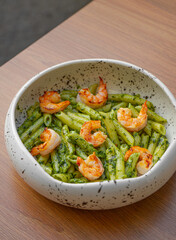 Penne pasta with shrimp and pesto sauce