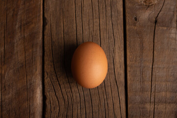 single egg on wooden table