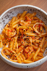 Pasta with saffron, shrimp, and black truffle