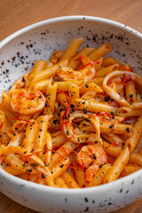 Pasta with saffron, shrimp, and black truffle