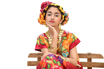Mexican girl with a floral dress from Oaxaca Mexico, hidden in a red background with braided flowers and gold necklaces, for Mexican culture dance