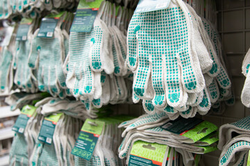Part of work-wear and protection equipment. Protective industrial work gloves in the store