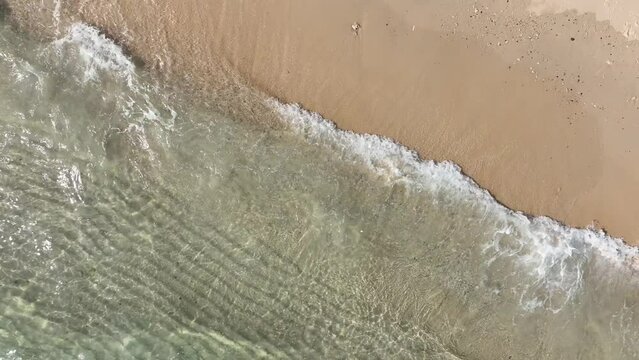 background for summer vacation concept. Nature of the beach and sea, summer with sunlight, sandy beach The sparkling sea water contrasts with the blue sky	