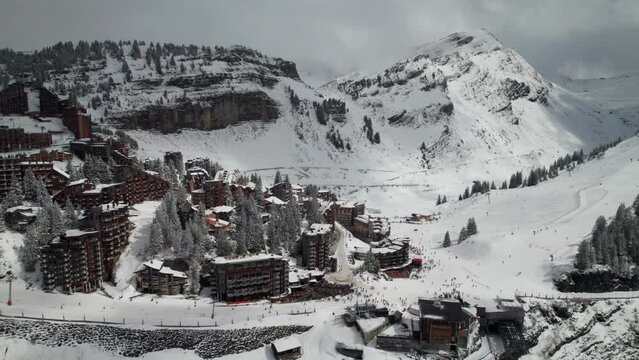 Busy ski resort in the French Alps, Avoriaz, Morzine, France. 4K Drone shot.