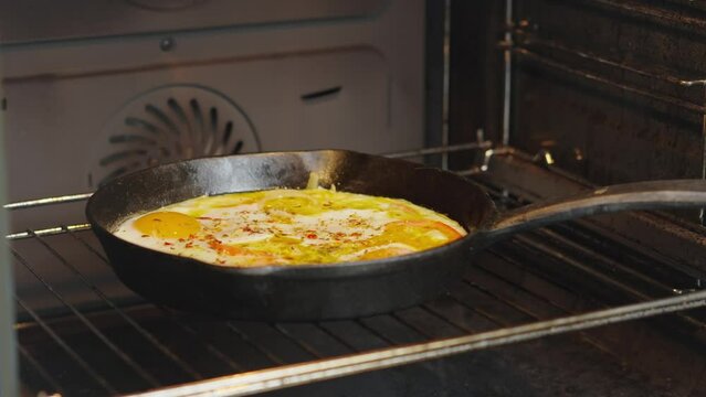 The video showcases cooking eggs in a skillet in the oven, perfect for culinary recipes and cooking blogs