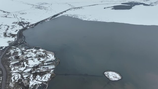 Aerial view of Paravani river floating in Saghamo Lake. Samtskhe-Javakheti, Georgia