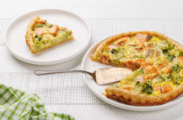 Homemade pie with salmon and broccoli
