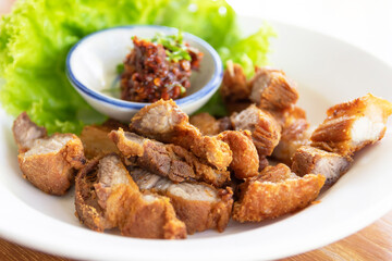 Sliced crispy pork belly with dipping sauce (spicy fermented fish sauce dip).