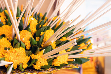 Candle and incense stick with flowers sets in Thai brass tray with pedestal, religious offerings at...