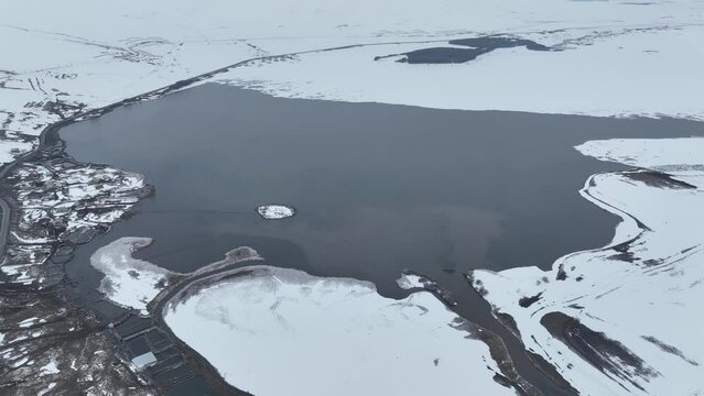 Aerial view of Paravani river floating in Saghamo Lake. Samtskhe-Javakheti, Georgia