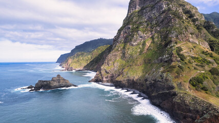 The majestic green mountains of Madeira rising above the crystal-clear, azure ocean; the natural beauty and wilderness of the island are breathtaking.