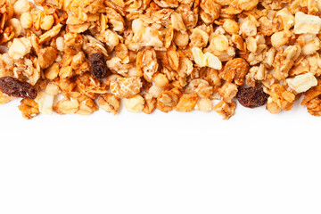 Muesli oat cereals with raisins, dried fruits and sunflower seeds border on white background. Copy space for text. Top view