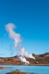 Cover page with geothermal active zones with power plants in Iceland, near Myvatn lake, summer and blue sky