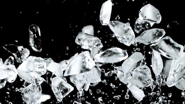 Super slow motion pieces of ice rise up and fall down. High quality FullHD footage