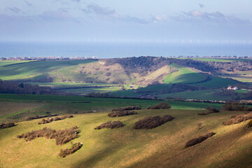 The white horse of Litlington on high and over view from Wilmington Hill on the south downs east Sussex south east England UK