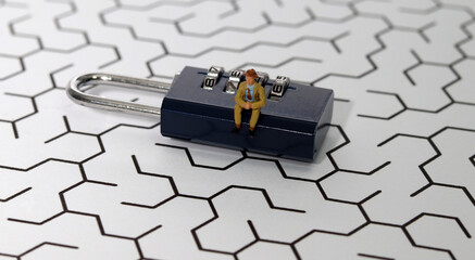 A businessman with secret codes in the maze. Worker and security key using as background security...