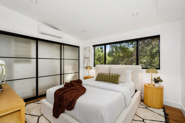 Modern Hollywood Hills home bedroom in Los Angeles, California, with a remodel of an older house