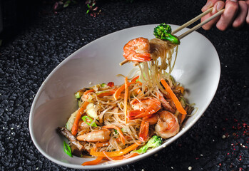In the image you can see an Asian dish, Thai seafood salad 
