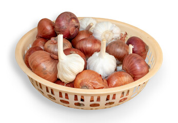 onions and garlic in the basket in white isolated background